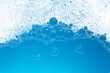 © Bowonpat - Detergent foam bubble on wate. Blue background, Soap sud