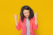 © Igor Link - Photo of ecstatic asian woman shout loud yeah fist up raise win lottery isolated bright shine color background