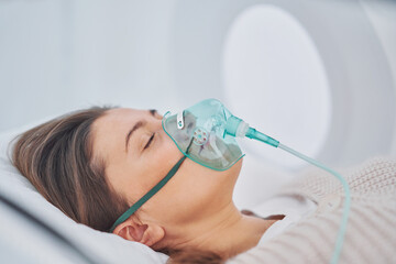 picture of brunette woman in oxygen cabin