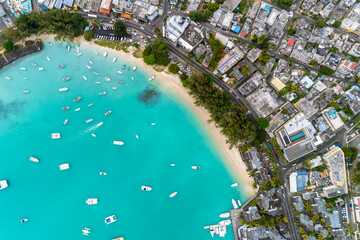 Wall Mural - Aerial view of the beach with palm trees and sea. Grand Baie Beach, Mauritius.