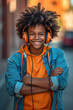 © tilialucida - A young boy wearing headphones and smiling. Generative AI.