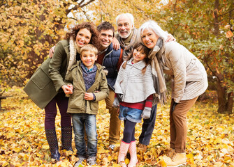 Wall Mural - Family smiling together in park