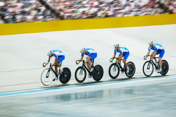 Wall Mural - Track cycling team riding around velodrome