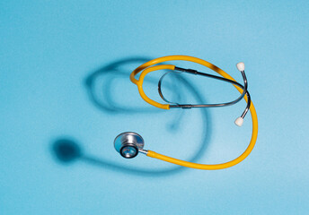 Doctors are working to develop new treatments that can extend more time to people's life. With the help of medicine, people are living longer, healthier lives. stethoscope on blue background