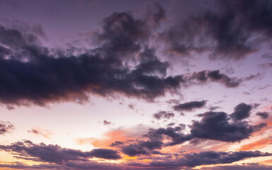 Wall Mural - dramatic cloudscape at dusk. sky in colorful evening light. changing weather forecast