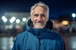 © Markus Schröder - Medium shot portrait photography of a satisfied mature man wearing a lightweight windbreaker against a sports stadium background. With generative AI technology