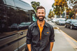 © VisualProduction - Delivery man standing in front of his van. Delivery man smiling and posing in front of delivery truck. Generative AI