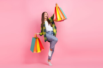 Canvas Print - Full body size of young funny woman crazy fists up hold much shopping packages black friday new collection discount isolated on pink color background