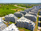 Fototapeta Na ścianę - Aerial view landscape, a modern estate with nice blocks of flats taken from a drone. Poland Cracow. 