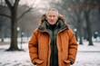 Full-length portrait photography of a tender mature man wearing a warm parka against a vibrant city park background. With generative AI technology