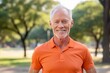 © Markus Schröder - Lifestyle portrait photography of a happy mature man wearing a sporty polo shirt against a vibrant city park background. With generative AI technology