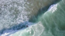 Bird's Eye View Of Surfer Carving And Riding Shortboard In Shorebreak Wave, Aerial