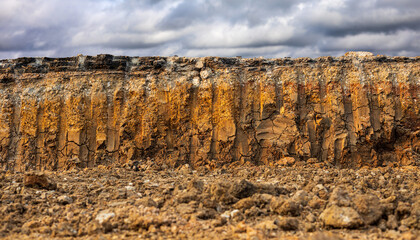 Low angle view, close-up background of the soil layer beneath the paved road.