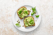 Avocado sandwich with pumpkin seeds. Healthy vegetarian avocado toast with rye bread for breakfast. Vegan menu. Top view