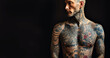 © annebel146 - Confident man with muscular body tattooed,Assertive tattoo artist posing in a dark studio with a half-naked body wearing jeans, tattooed in a japanese irezumi style, looking cool and confident.