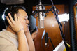 Asian professional singers recording in audio recording studio, professional male and female singer or vocalist singing in the studio.