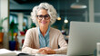 © PETR BABKIN - Generative Ai. smiling woman sitting at a desk with a laptop computer