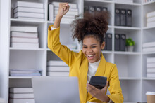 Excited African American Woman Sit At Desk Feel Euphoric Win Online Lottery, Happy Black Woman Overjoyed Get Mail At Tablet Being Promoted At Work, Biracial Girl Amazed Read Good News At Computer