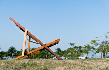 Deck chair on the meadow in the garden