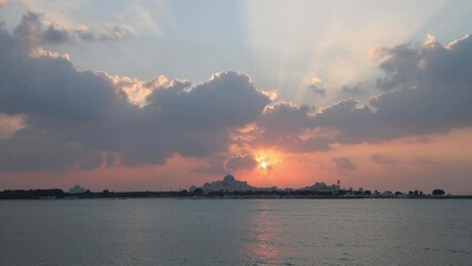 Wall Mural - Enchanting sunset in Abu Dhabi on a cloudy day