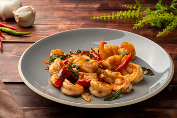 Wall Mural - Stir fried shrimp with thai basil on grey plate,thai spicy food