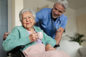 Wall Mural - Caregiver doing regular check-up of senior woman in her home.