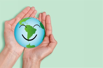 Sticker - Hands holding a globe of earth with cute smile face