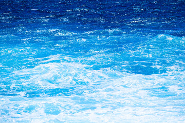 Wall Mural - the sea as a background. waves and sea foam. water color gradient. nature photo for design and backg