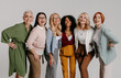 © gstockstudio - Multi-ethnic group of happy mature women bonding against grey background