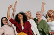 © gstockstudio - Multi-ethnic group of happy mature women gesturing and smiling against grey background