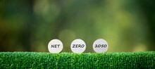 Net Zero And Carbon Neutral Concepts Net Zero Emissions Goals A Climate-neutral Long-term Strategy Ready To Put Wooden Blocks By Green Net Center Icon And Green Icon On Bokeh Background.