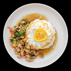 Wall Mural - Khao Pad Ka Prao Gai Kai Dao, Thai food, streamed rice topped with basil stir fried chicken and fried egg in ceramic plate isolated on black background, square ratio