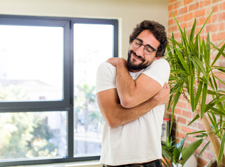 Wall Mural - young adult crazy man with expressive pose at a modern house interior