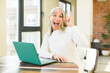 © kues1 - senior pretty woman feeling like a happy and excited genius after realizing an idea with a laptop