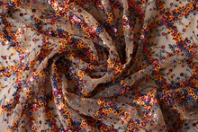 Twisted Spiral Sheer Fabric With Blue And Orange Shiny Sequins