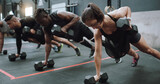 Gym class, weights and plant of workout, training and exercise group with strength. Diversity, people and strong challenge for body lifting and fitness of athlete friends with dumbbell for health
