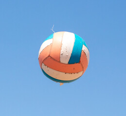 Volleyball ball against the blue sky.