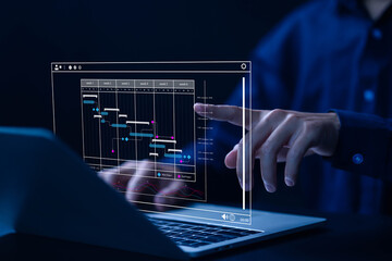 Fototapete - business manager managing business planning project schedules in the office. Gantt chart showing on virtual screen.	
