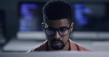 Sticker - Face, glasses and programming with a black man coder working in a dark office for data processing. Focus, software development or programming with a male coder reading computer language on a database