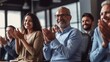 © GustavsMD - Colleagues applauding during a team meeting in an office. Generative AI.