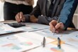 © Natee Meepian - Financial analyst analyzes business finance reports on laptop and graph documents during corporate meeting discussions showing successful teamwork, business meeting ideas, marketing