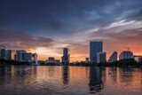 Fototapeta  - Orlando Florida Lake Eola cityscape with a sunset on the horizon