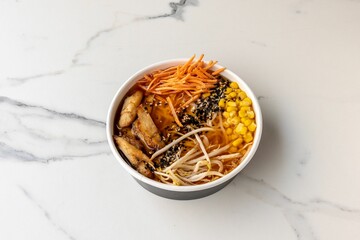 Poster - Top view of a tasty poke bowl with corn on the marble table