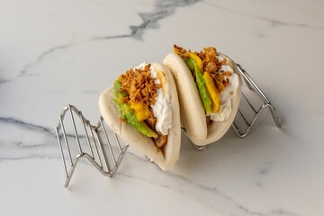 Sticker - Steamed gua bao buns served on the marble table