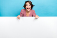 Photo Of Young Crazy Woman Indicating Fingers Empty Space Banner Crazy Proposition Product Placement Isolated On Blue Color Background