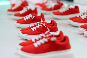 Group of children sports shoes in the store