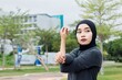 asian young muslim female excercise at park