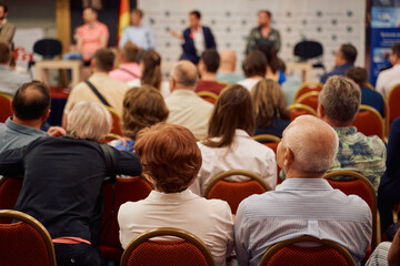 Wall Mural - Speaker at Business Conference and Presentation. Audience at the conference hall.