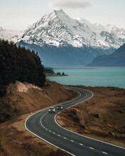 Scenic Winding Road Along Lake Pukaki To Mount Cook National Park, South Island, New Zealand During Cold And Windy Winter Morning. One Of The Most Beautiful Viewing Point Of Aoraki Mount Cook.