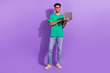 Fototapeta  - Full length photo of young student guy wear glasses hold laptop studying coding future successful programmer isolated on violet background